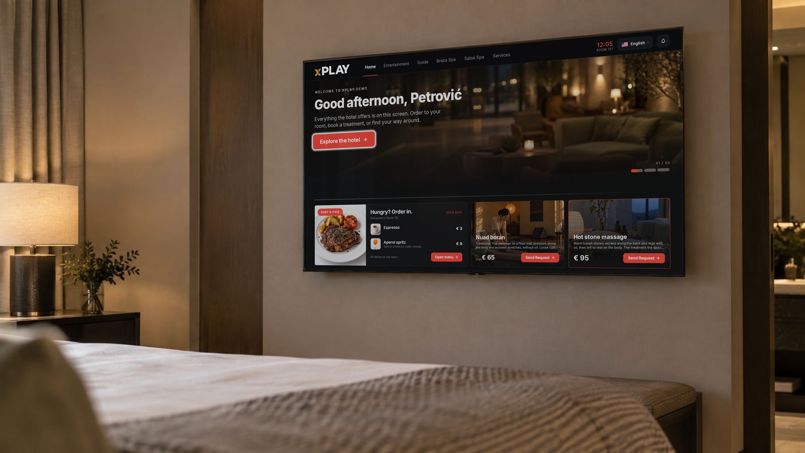 The room TV on the wall, open on its home: Good afternoon, Petrović
